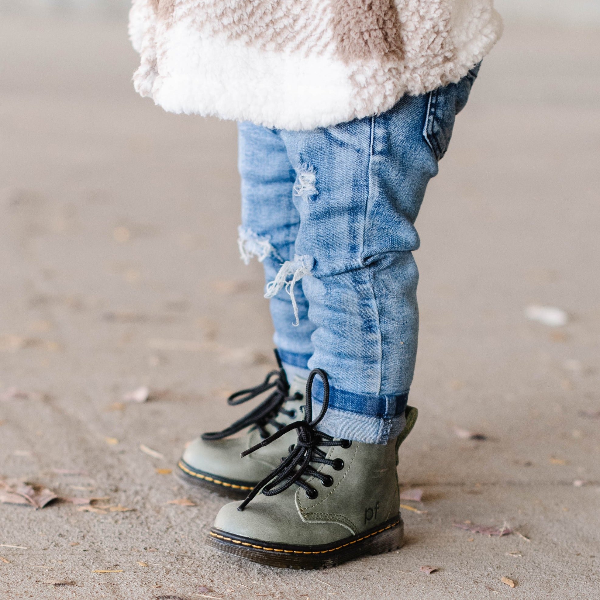 Infant girl deals combat boots